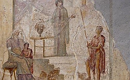Kassandra predpovedá pád Tróje pred svojim otcom Priamom (sediaci), Paris (drží jablko sváru), bojovník držiaci oštep je pravdepodobne Hektor. Freska (obraz maľovaný priamo na omietku steny) je z Pompejí.
